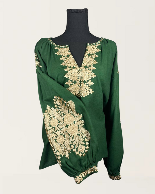 Elegant green blouse with intricate gold embroidery, perfect for a sophisticated look. Ideal for various occasions.
