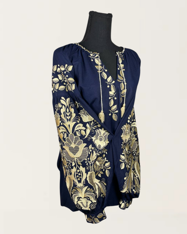 Phoenix blue blouse featuring intricate gold floral embroidery and a relaxed fit, perfect for stylish casual wear.