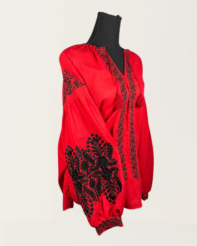 Red blouse with black embroidery