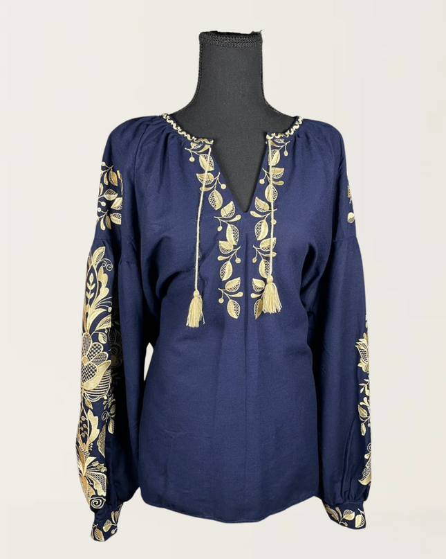 Phoenix blue blouse with intricate floral embroidery and tassel details, showcasing a stylish and elegant design.
