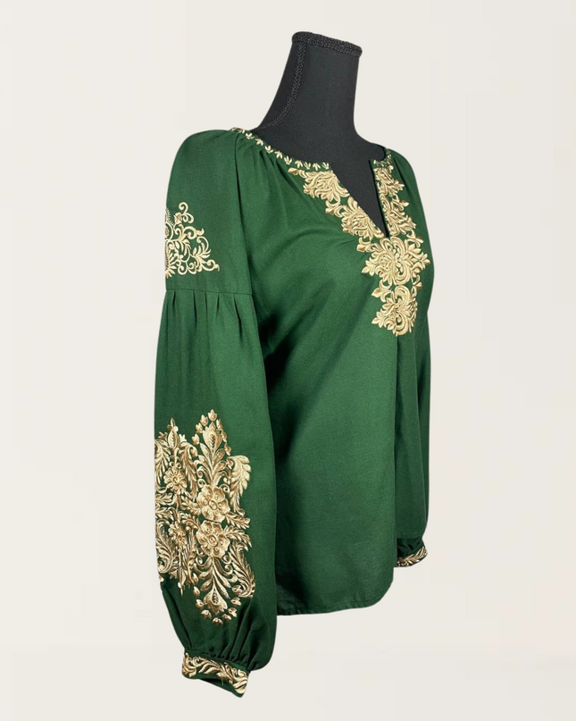 Green blouse featuring intricate gold embroidery, perfect for stylish casual or dressy occasions.