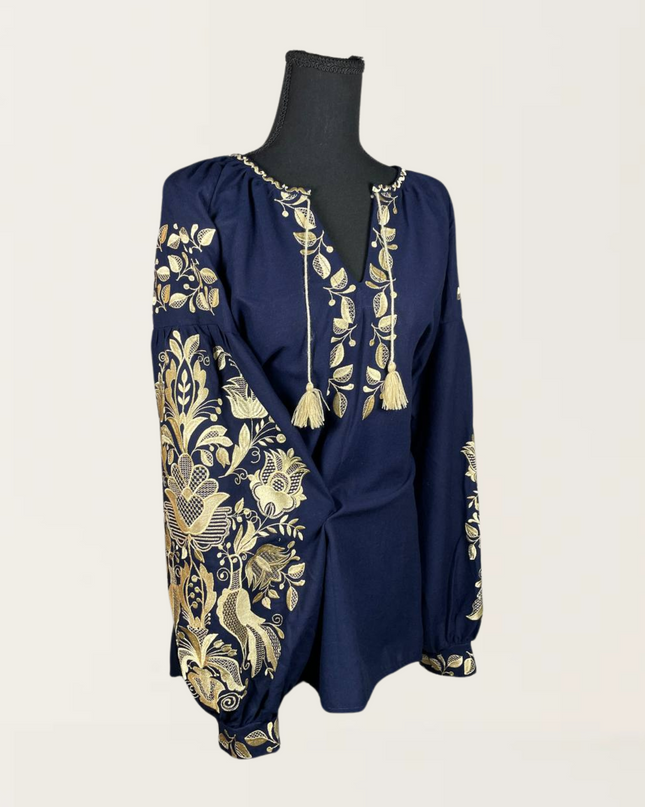Phoenix blue blouse with intricate gold embroidery and tassel accents, perfect for stylish casual wear.