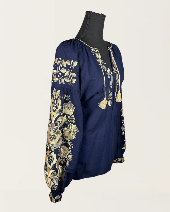 Elegant blue blouse with golden embroidery and tassel details, perfect for stylish occasions.