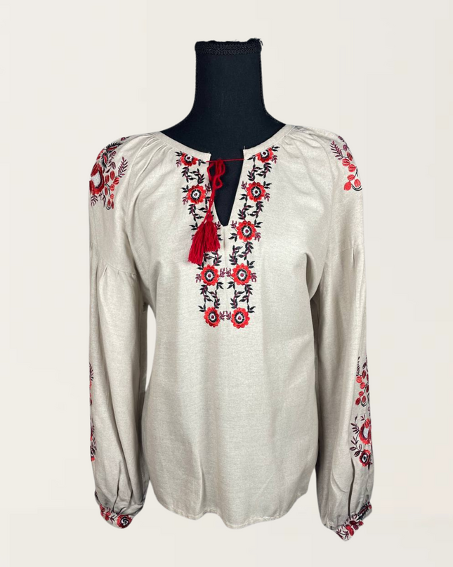Beige blouse with daisies